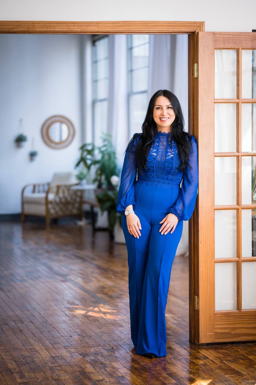 Elissa Stevens-Smith standing full length in blue